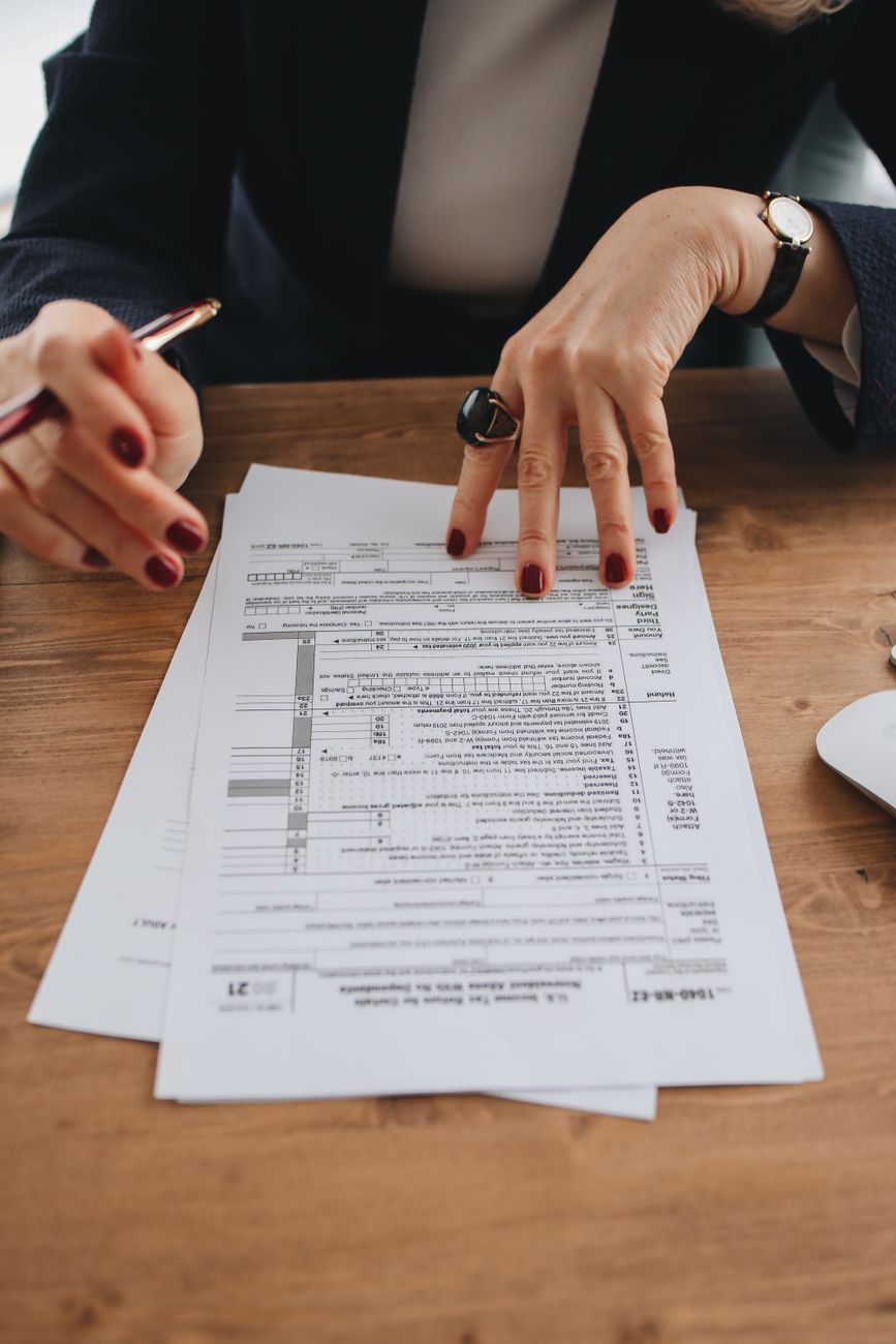 Collaborator pointing at tax declarations screen